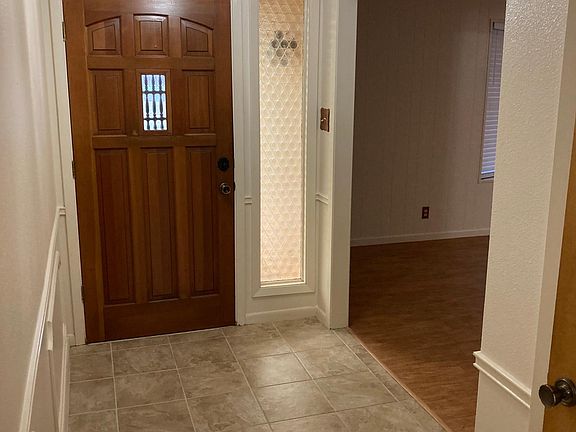 Front door and entry hall. Living Room to the right