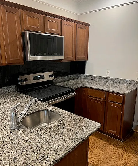 Granite counters, new appliances including upgraded microwave/air fryer combo