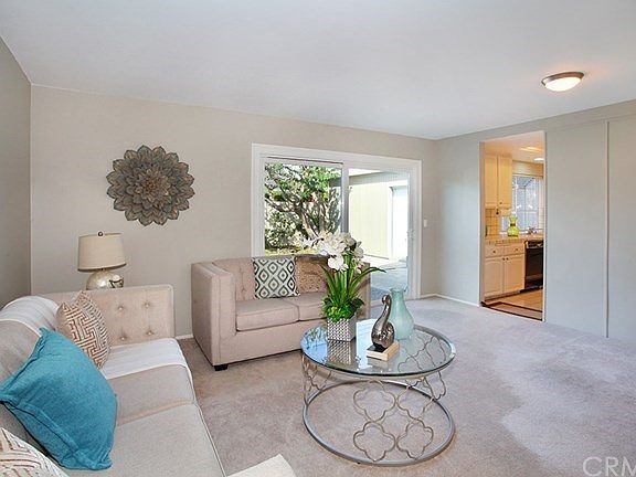 Family room with dual paned sliding glass doors also accesses the spacious backyard.