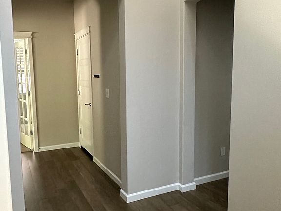 wrap around style downstairs leading to the kitchen/dining/living room and back to the front door.
