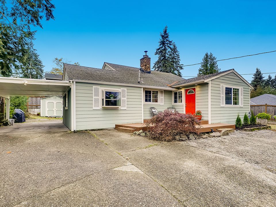 Front of home with carport, shed and ample off-street parking.