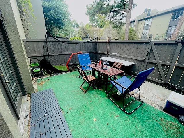 Back porch leads outside to the Ivy Gardens, Tennis Court and Pool!