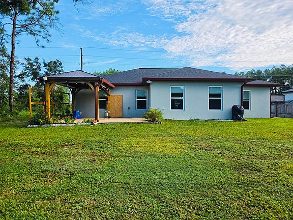 Exterior: Backyard and gazebo