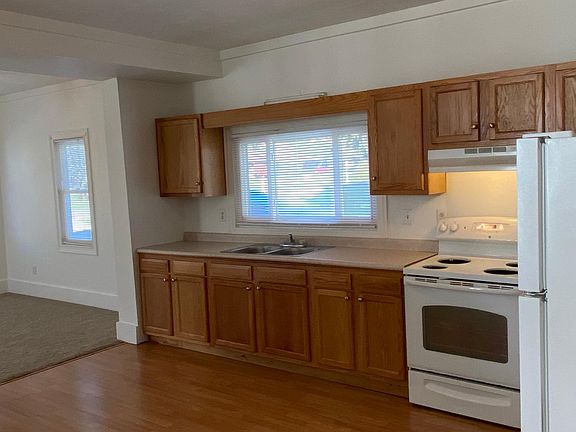 Kitchen with electric range, refrigerator and in sink disposal. Lots of cabinet space!