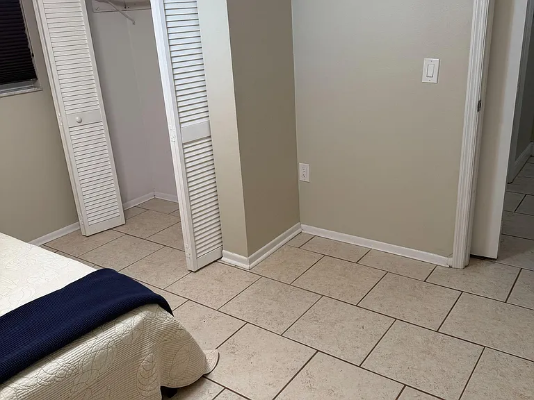 located at the end of the hall next to the bathroom