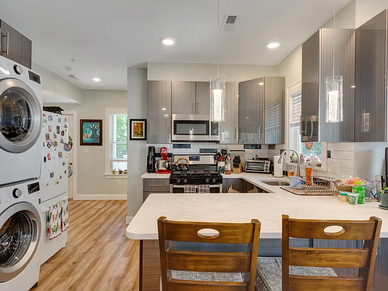 Eat-in kitchen peninsula with pendant lights
