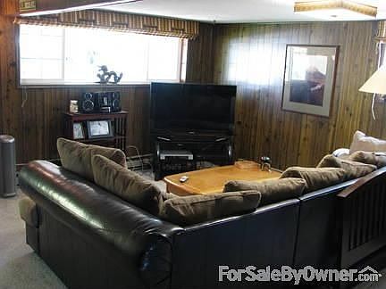 large familyroom with loft bedroom over