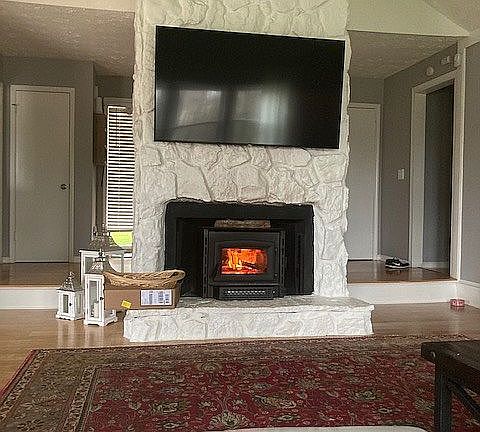 STN CHIMNEY WITH WOOD STOVE