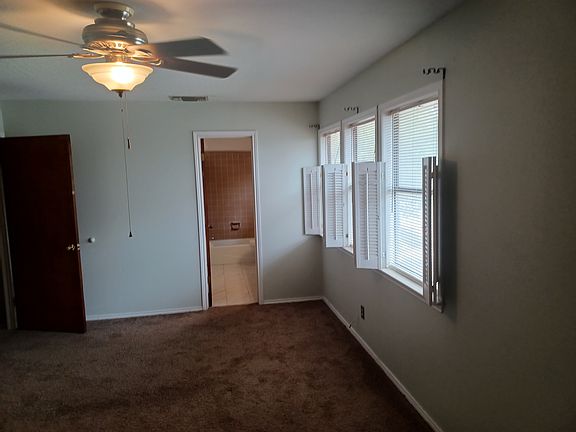 Master bedroom with view of bathroom