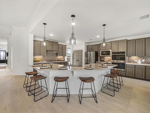 Kitchen with island and pendant lighting