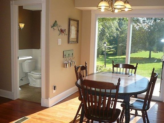 1/2 bath off of kitchen. Sliding glass door lead to deck overlooking backyard.