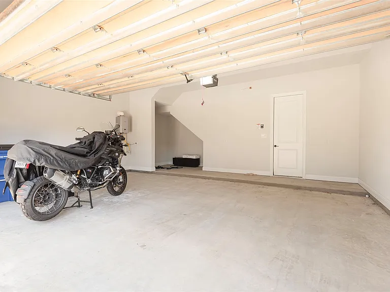 Over-sized 2 car garage with additional storage space