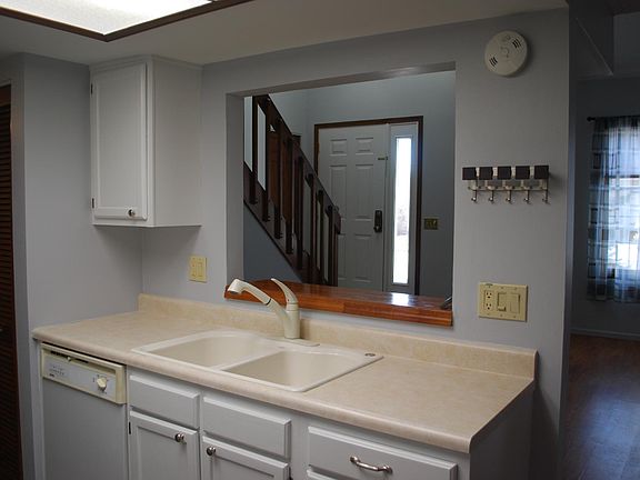 Kitchen looks into family room