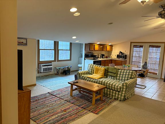 Open concept living room/kitchen/dining