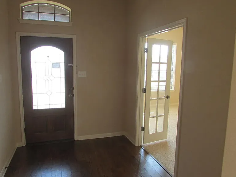 entry door and office on the right (office has hardwood floor now)