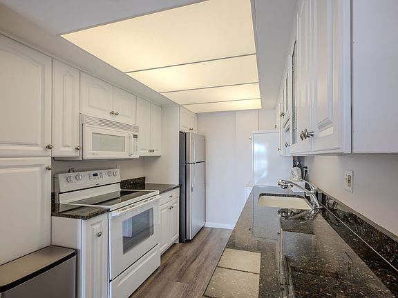 Fully equiped kitchen with beautiful udpates of new fridge, granite countertop.