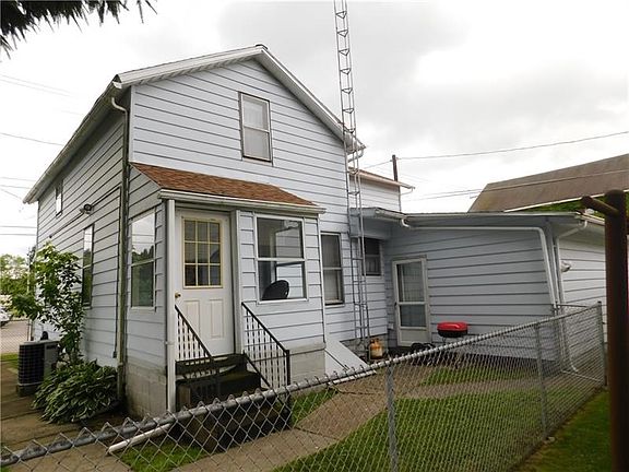 REAR ENCLOSED PORCH FENCED YARD