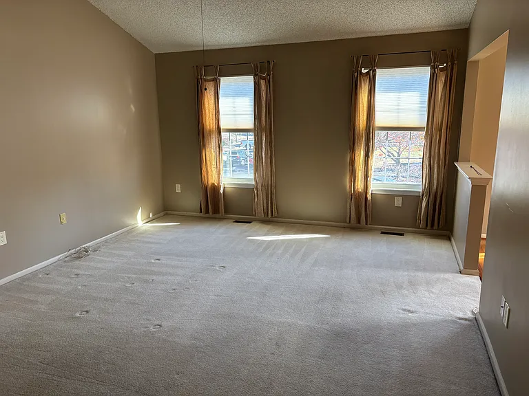 Vaulted Ceiling Fanned Master Bedroom with sitting room/home office space.