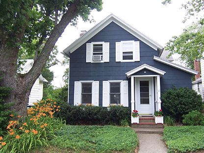 dark blue house with red door