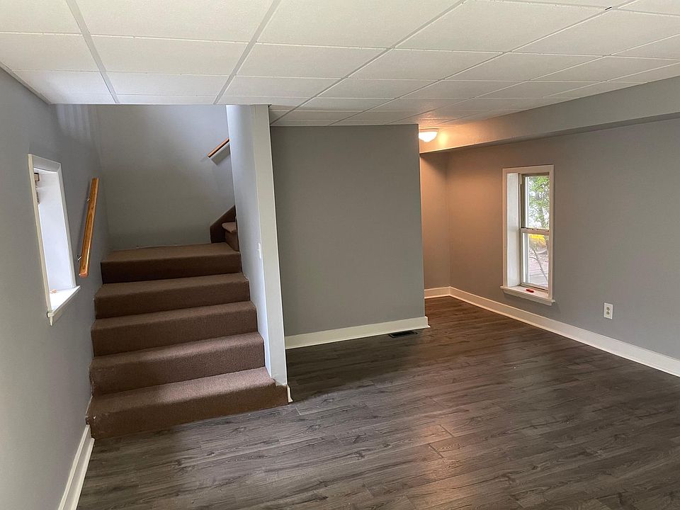 Living room with storage closet, stairs to bedroom
