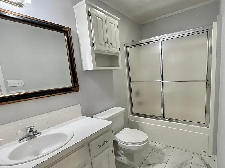 Secondary Bathroom w/tub shower combo.