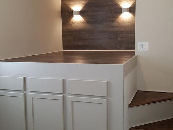 Unique loft-style bed with built-in storage.