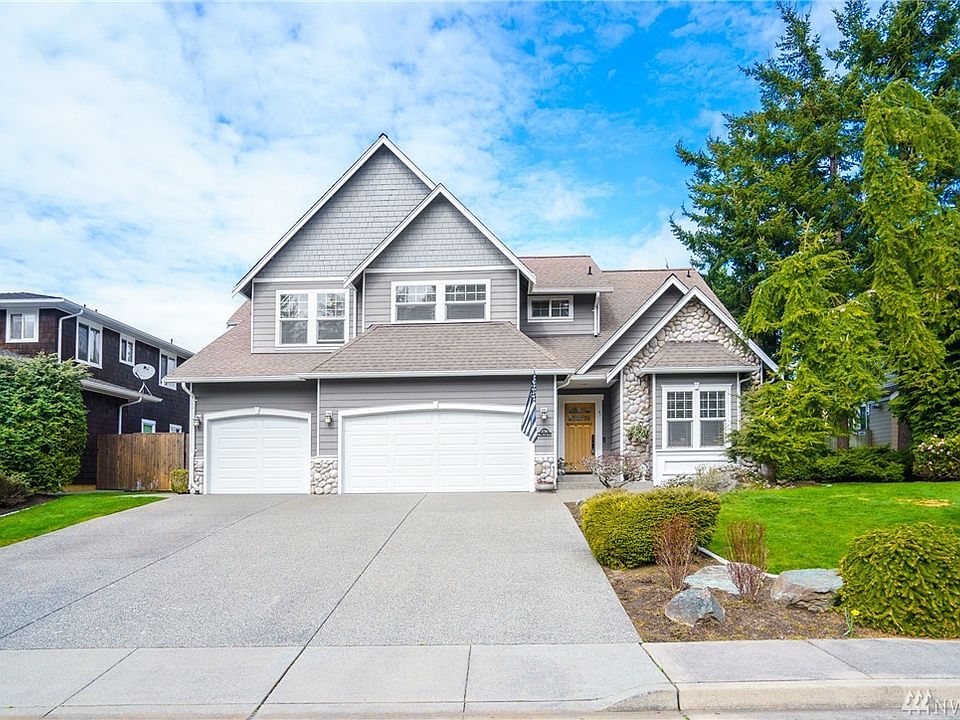Welcome to 3716 W 12th St in Rock Ridge. This stunning 2 story features 3222 sq ft with main level living, upstairs bonus room, well designed floor plan, enchanting landscaping with lawn concrete curbing, new expansive composite deck, hot tub....the list goes on and on. Located on a culdesac with access to trail system.
