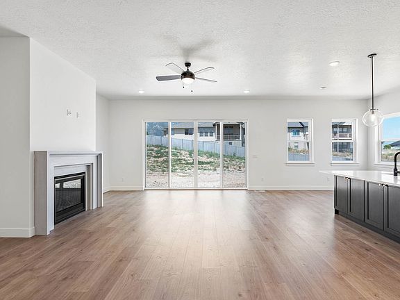 The family room is large and has lots of windows and a gas fireplace.