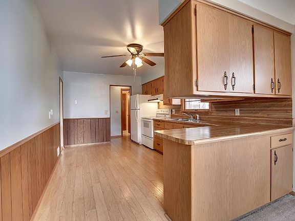 Kitchen has newer laminate floor