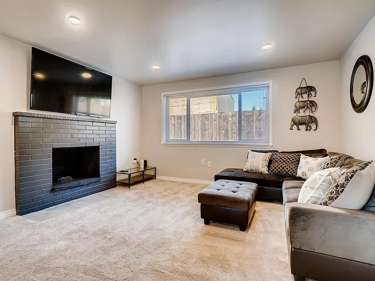 Cozy and comfortable downstairs living room with big 65" TV