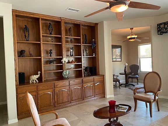 oak floor to ceiling bookcase in the living room