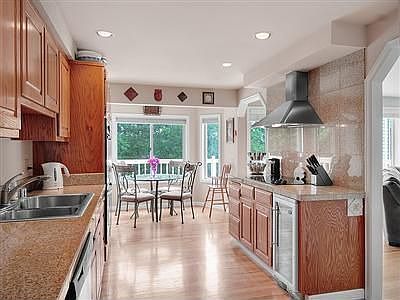 Fantastic kitchen, granite counters top oak cabinetry, a smooth top range and a wine chilling refrig