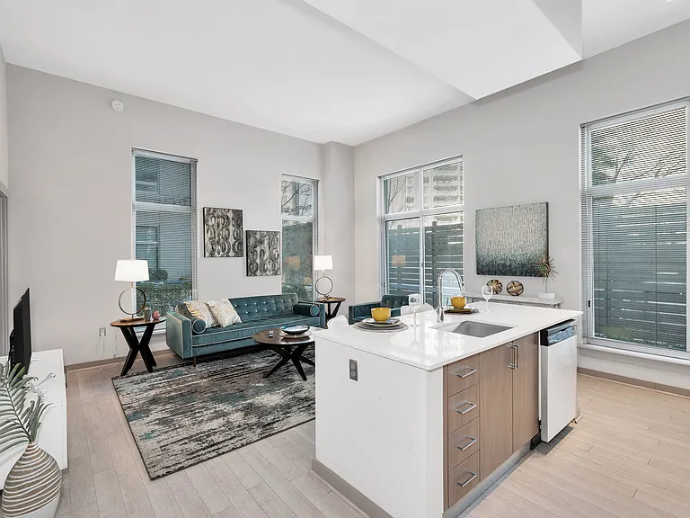Kitchen island with built-in sink and Italian cabinetry in select apartment homes