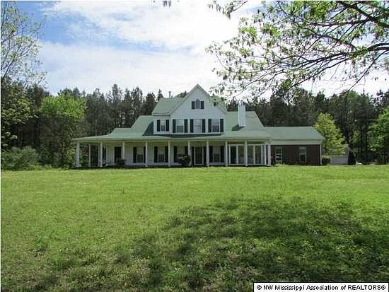 Tranquil home nestled among pine trees, away from the hustle and bustle of city living.