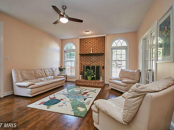 Family room with fireplace adjoins kitchen
