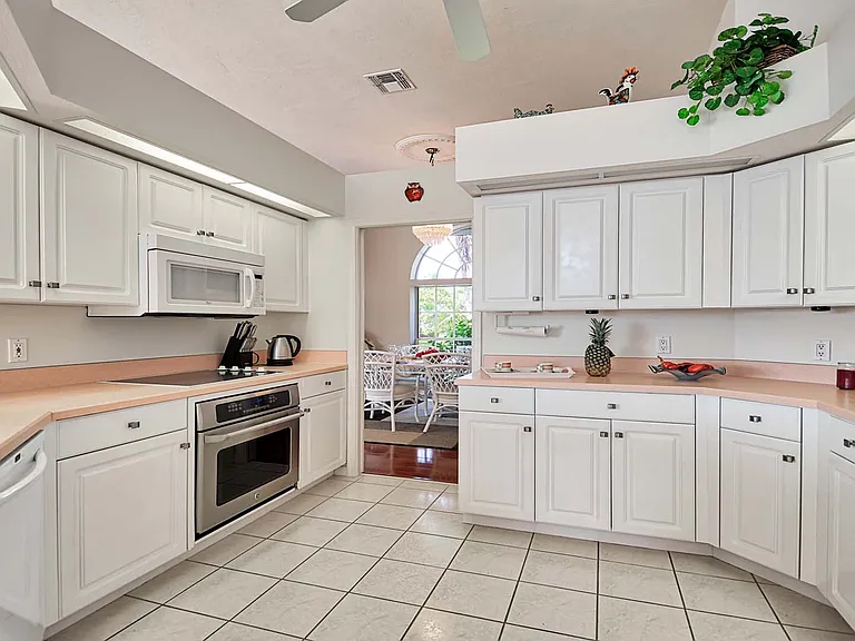 furnished kitchen with plenty of utensils and dishes