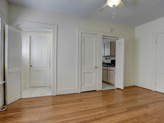 From this view of the living room you can see the entrance to the bathroom, hall closet and kitchen.