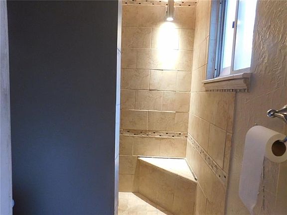 Beautiful tile shower in the main floor full bathroom!