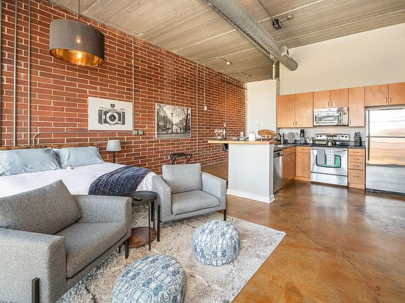 Open floor plan with fully stocked kitchen.