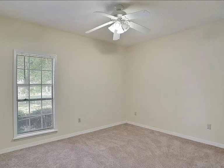 Bedroom #2, new carpet, ceiling fan, window