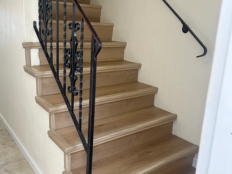 Stairs to right of Main Door Entry leading to two bedrooms upstairs