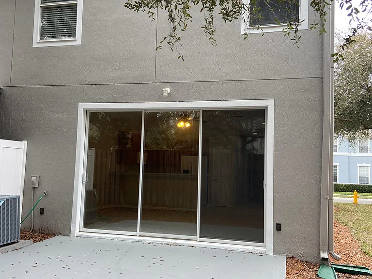 large patio with full wall of sliders off livingroom