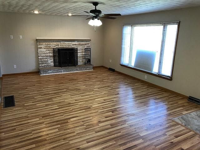 Living Room with Wood Burning Fireplace