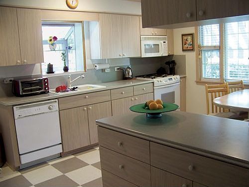 Large modern kitchen with a garden window facing the park!