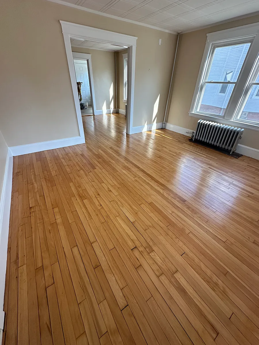 View from front door upon entry to the unit. Floors refinished in 2024. - 14 Rosemont Ave #102