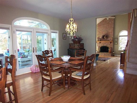 The breakfast area is adjacent to the kitchen with atrium door to solarium
