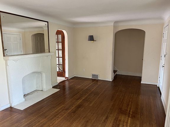 Living Room with beautiful hardwood floors and faux fireplace