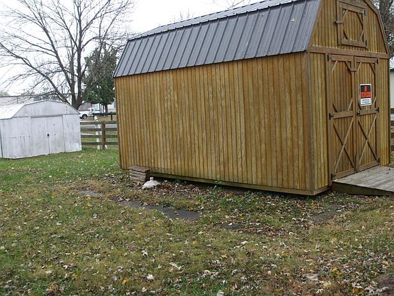 Newer shed in front