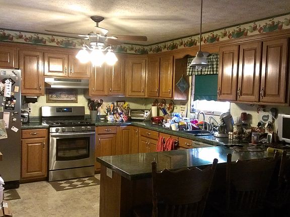 Stainless steel gas stove, refrigerator and dish washer.