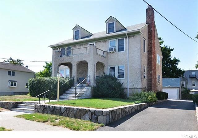 Curb view, showing portico/partially enclosed porch - great for catching summer breezes and views of